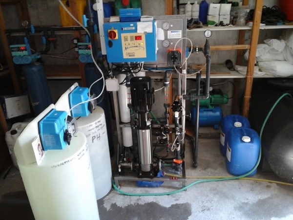 Filtration equipment with blue tanks and pipework in a shed