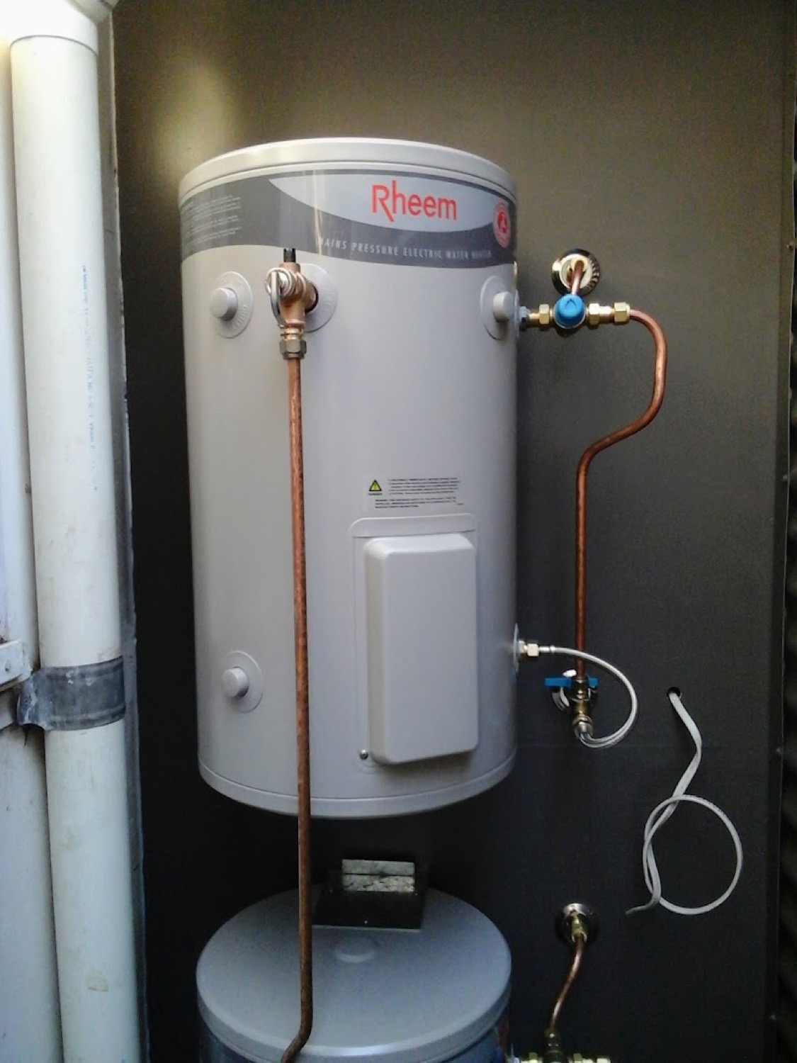 A new hot water cylinder connected with copper pipework